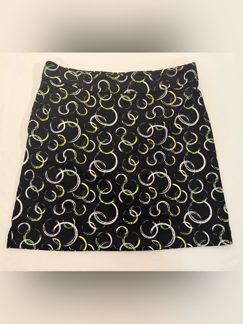 Greg Norman Woman's Golf Skort with White, Yellow & Lime Ring Print